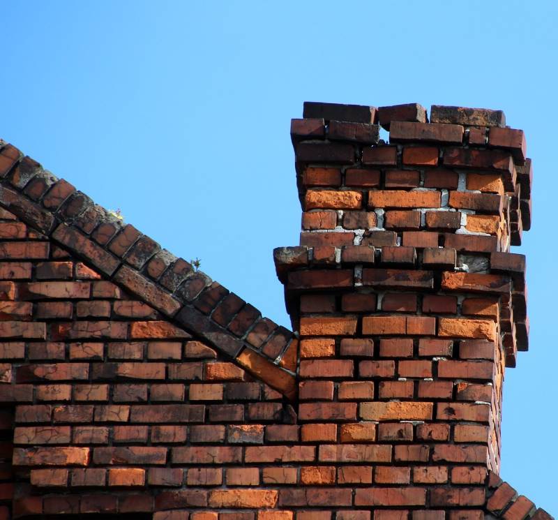 Blog Article - Damaged chimney on an Saginaw home showing cracks and missing mortar